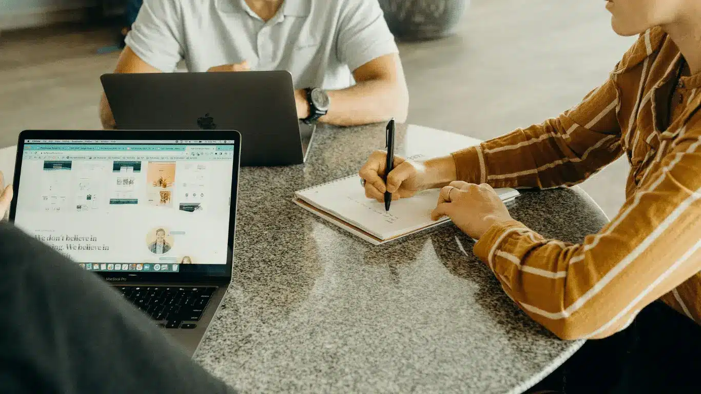 People working through a plan together at a table
