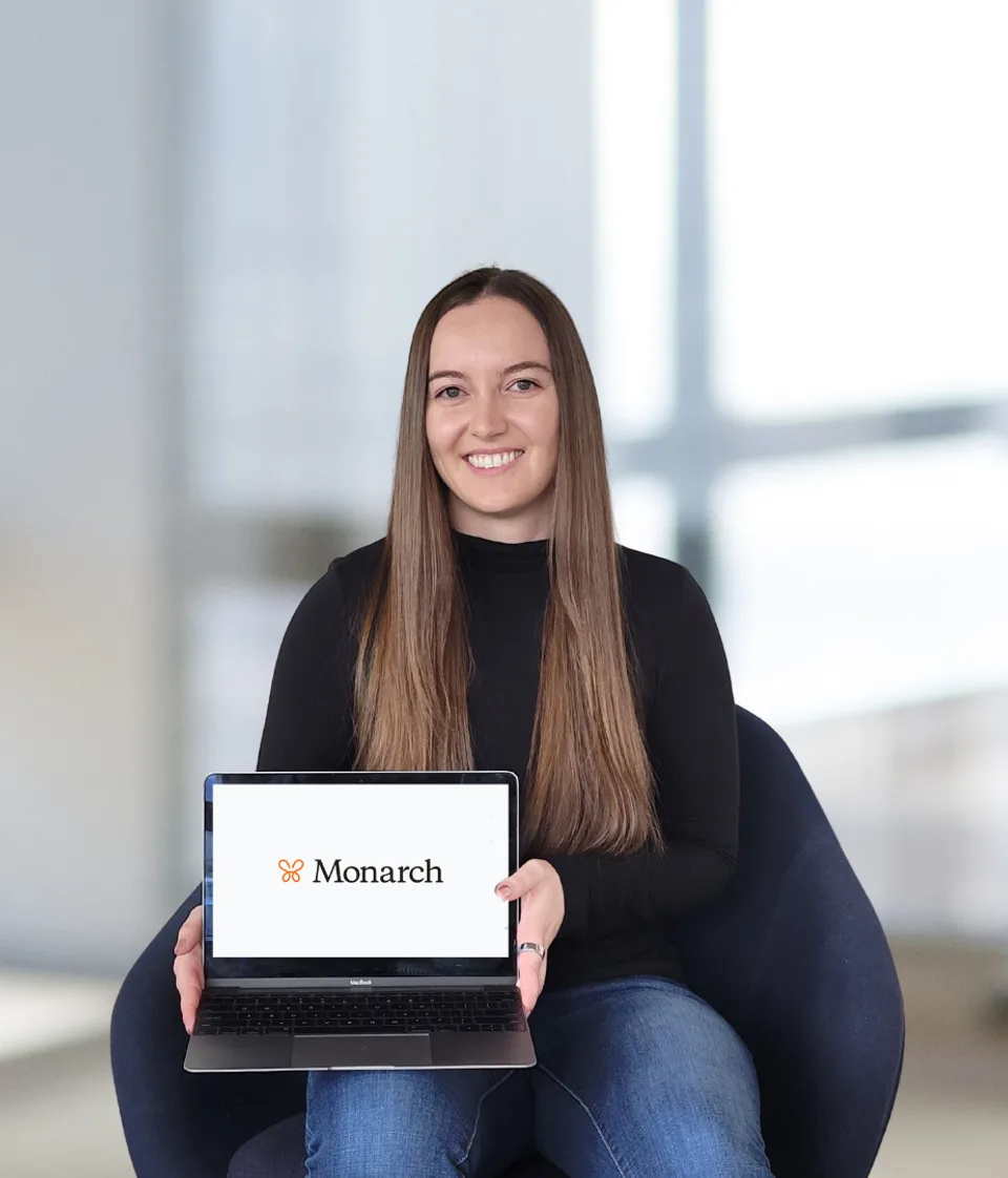 Taylor Smith seated with a laptop showing Monarch Money